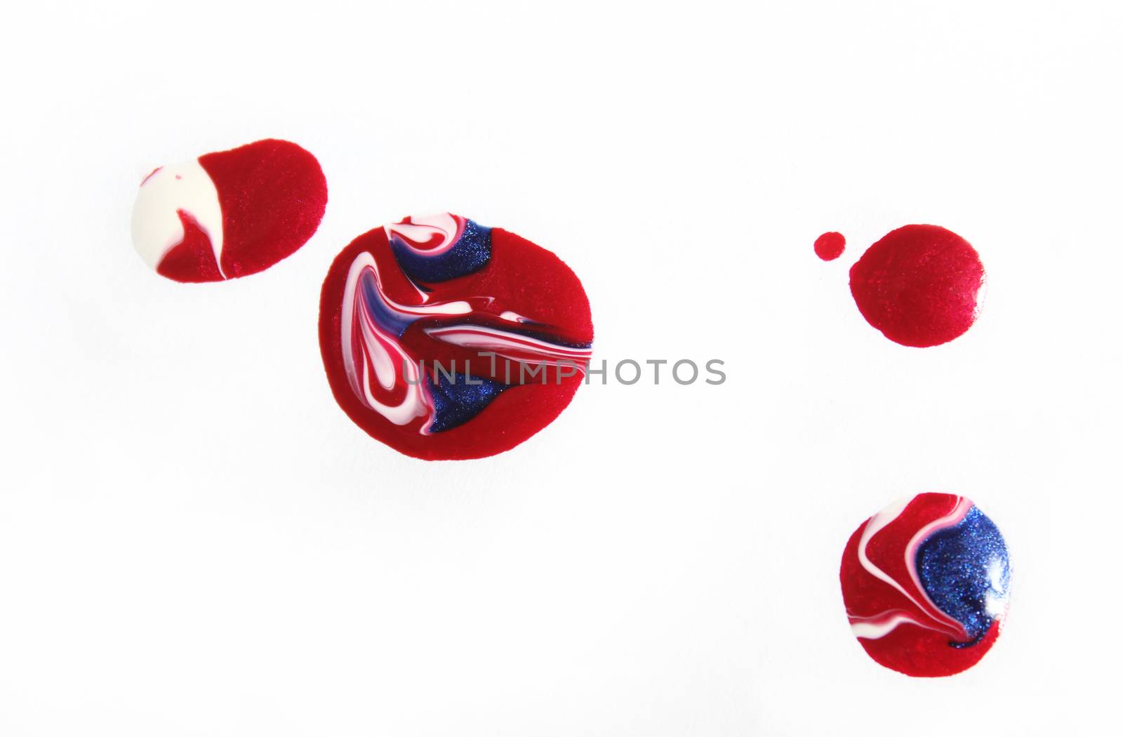 Red, White and Blue Nail Polish Spilled on White by Marti157900