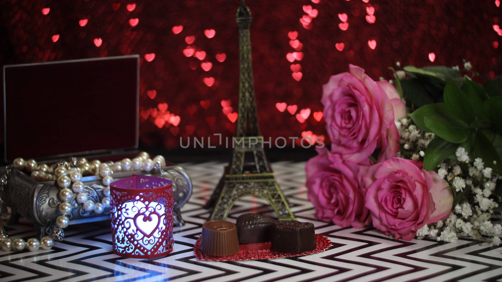 Pink Rose With Eiffel Tower Replica Shallow DOF, Focus on chocolate candy