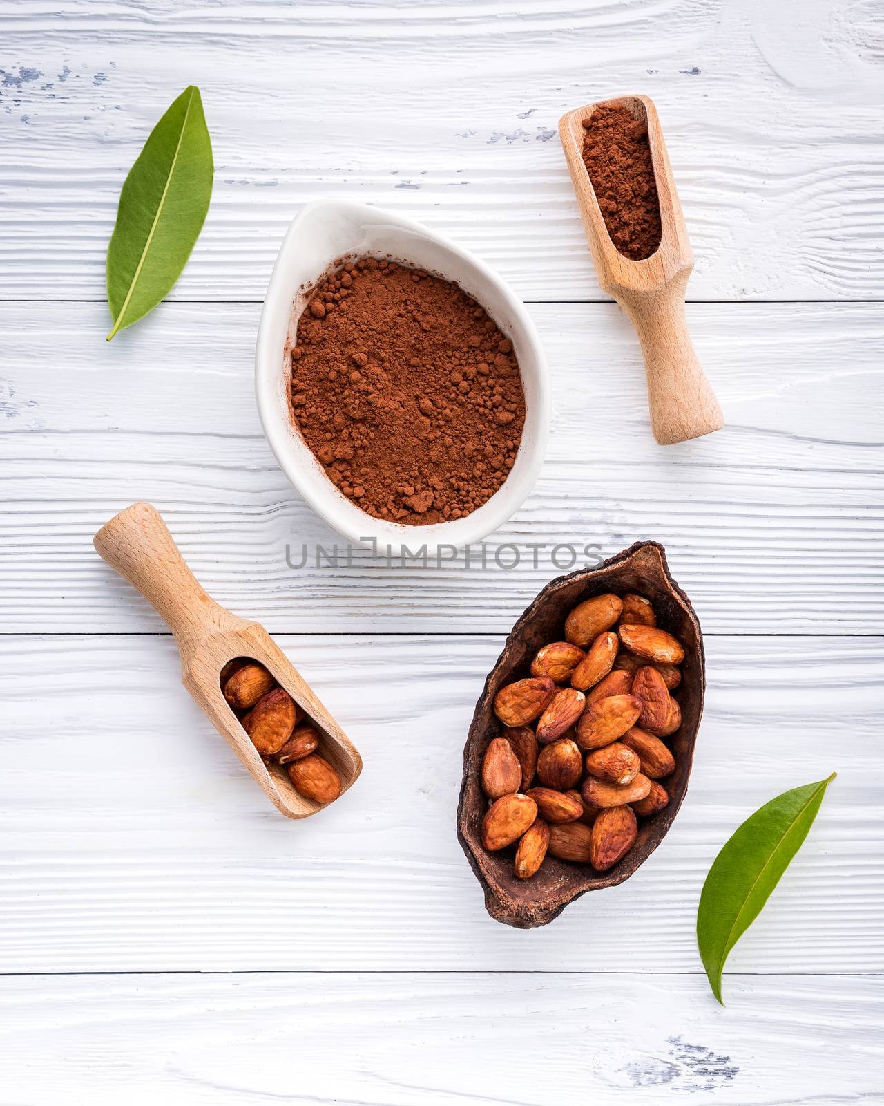 Cocoa powder and cacao beans on wooden background. by kerdkanno