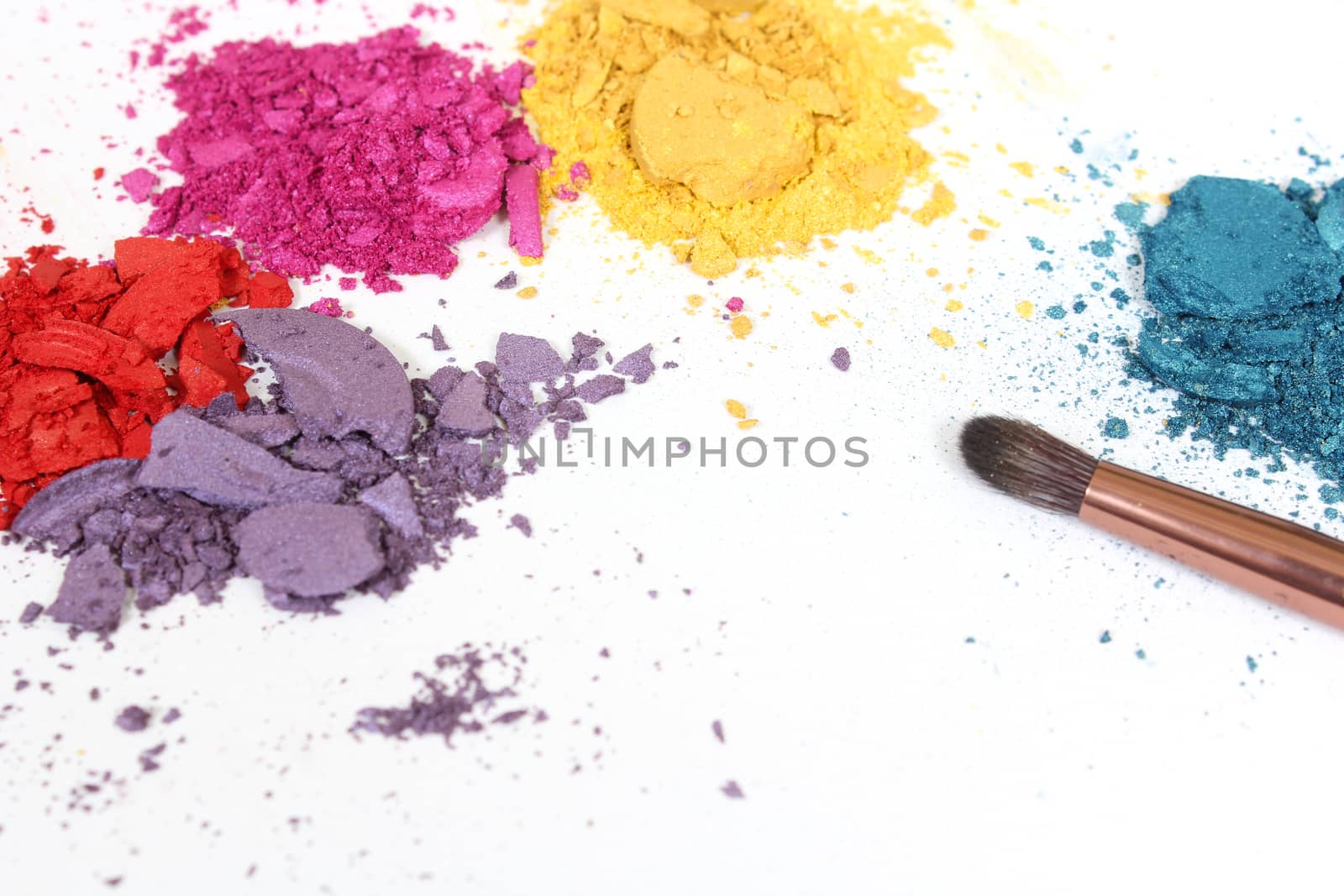 Broken Cosmetic Pigments With Brush on White Background