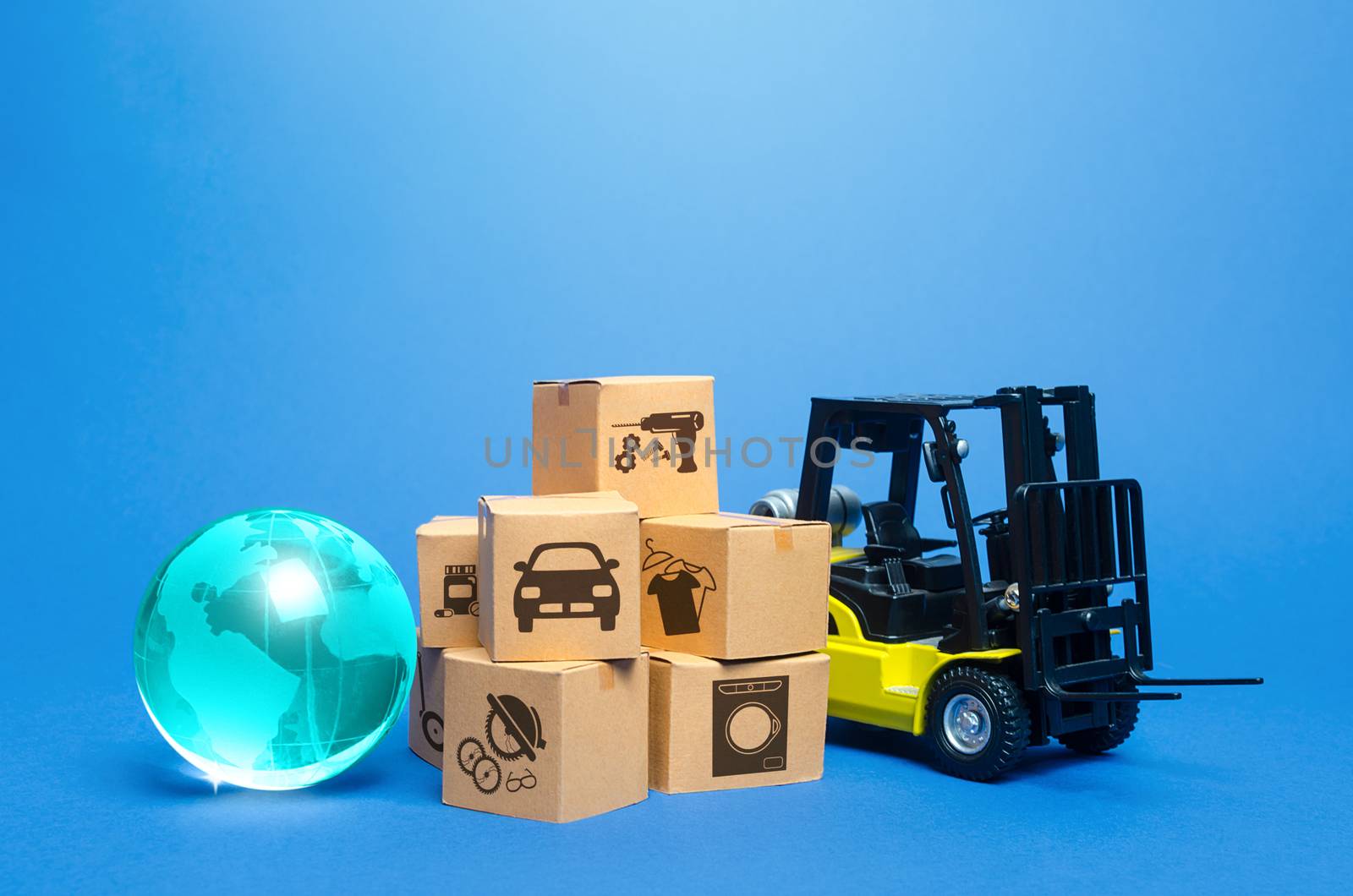 Forklift truck near cardboard boxes and blue globe. Transportation logistics infrastructure, import export of goods. Freight shipping. Globalization of production, sales of products on world markets.