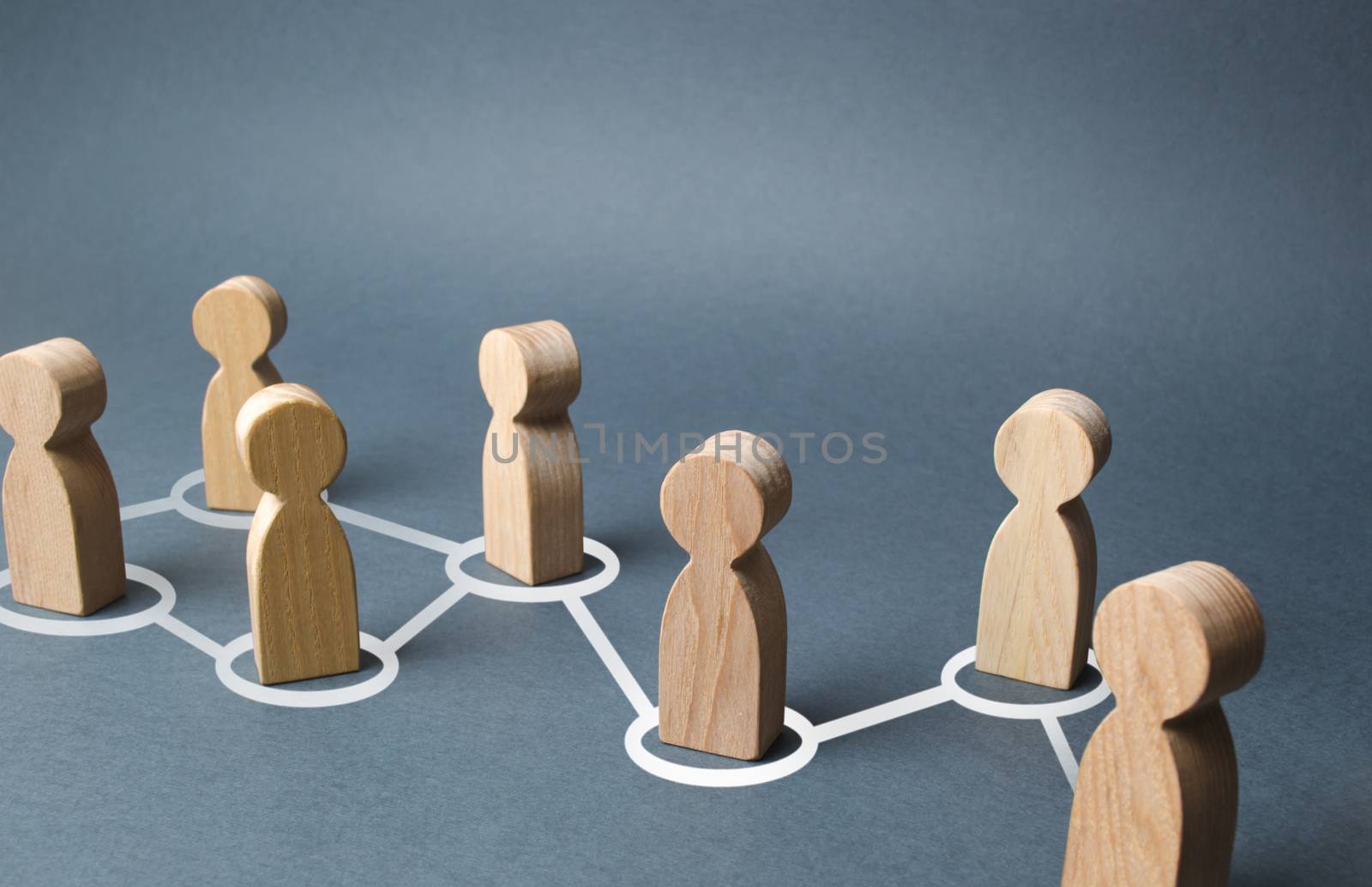 Chain of people figurines connected by white lines. Cooperation and interaction between people and employees. Dissemination of information in society, rumors. Communication. social contacts