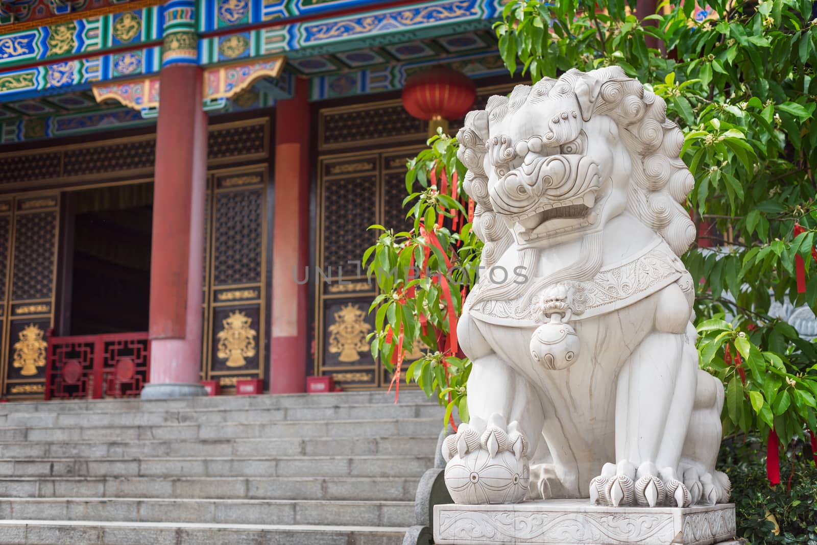 Lion white stone sculpture in a buddhist temple in Chengdu, China