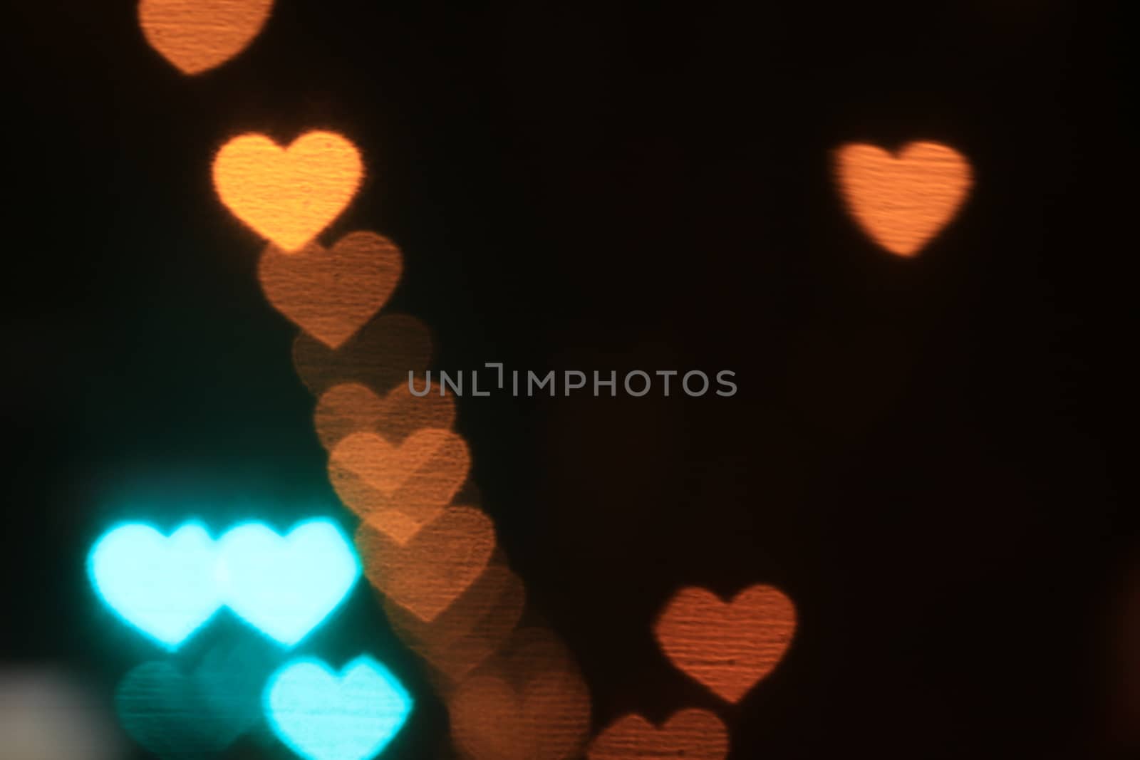 Valentines Colorful heart-shaped on black background lighting bokeh for decoration at night backdrop wallpaper blurred valentine, Love Pictures background, Lighting heart shaped soft at night abstract