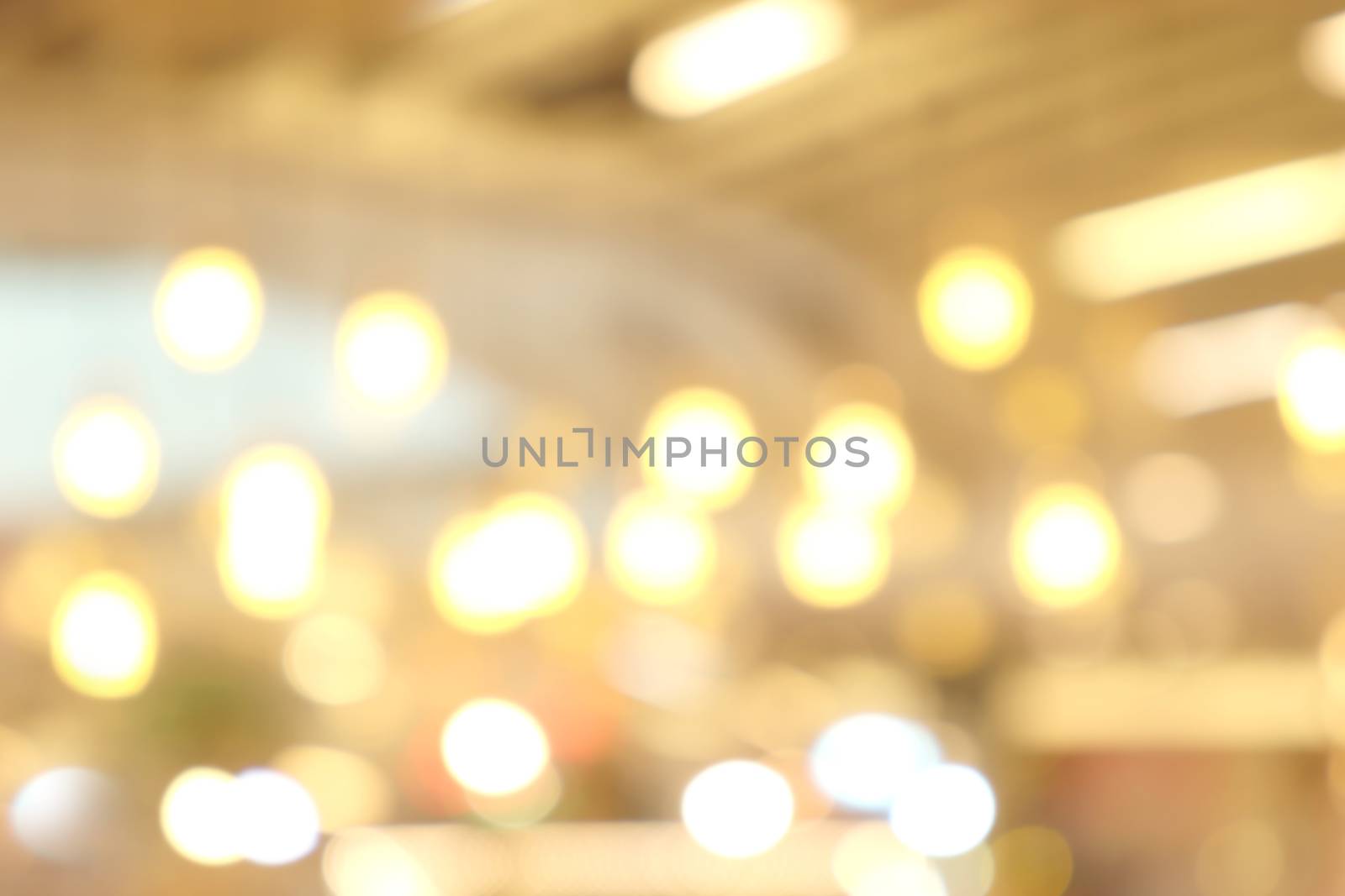 blurred light yellow gold bokeh Inside the mall luxury for background, bokeh golden abstract light shine background blur
