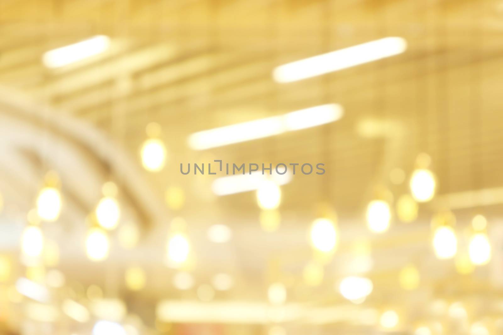 blurred light yellow gold bokeh Inside the mall luxury for background, bokeh golden abstract light shine background blur by cgdeaw