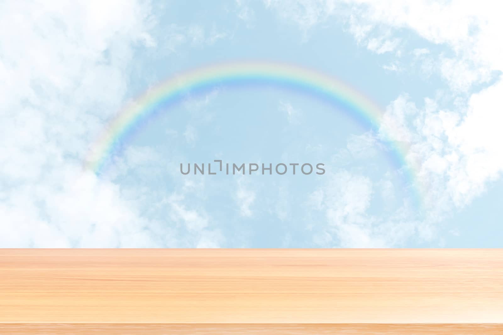 empty wood table floors on blurred sky and rainbow background, wood table board empty front sky rainbow, wooden plank blank on rainbow sky with perspective brown wood table for mock up display product