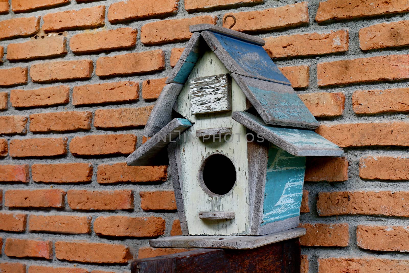 wood house bird, old house for bird on red brick wall, small wood house on wall old