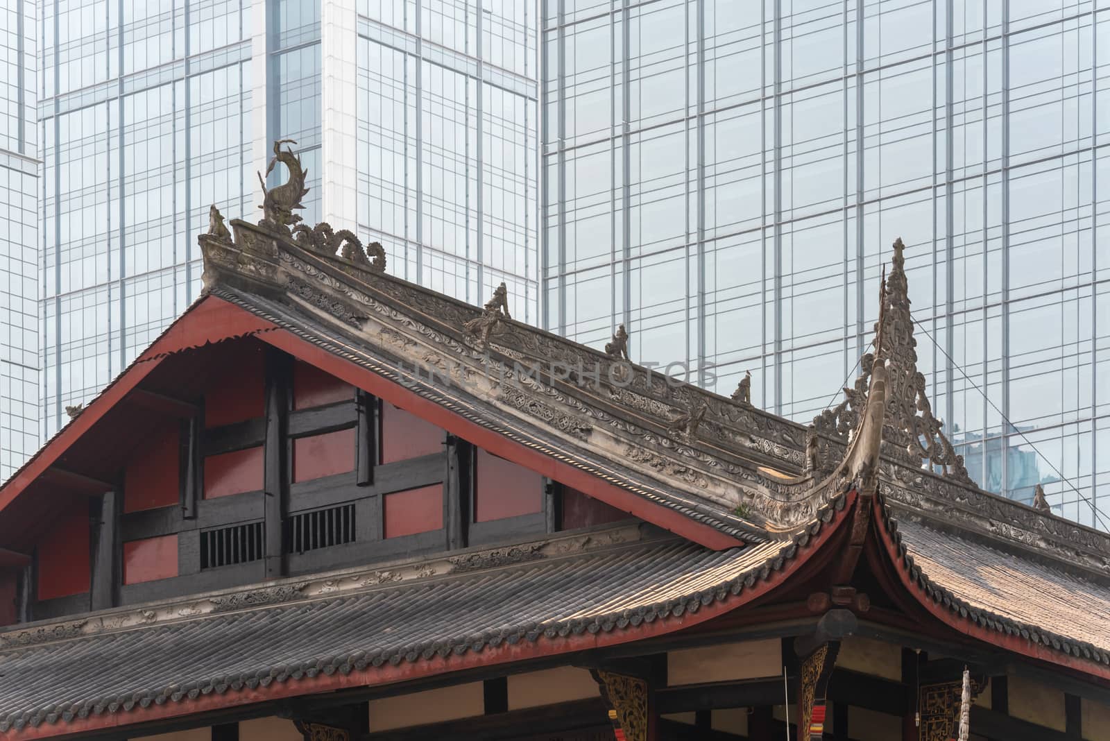 Daci buddhist temple against modern building in Chengdu, China