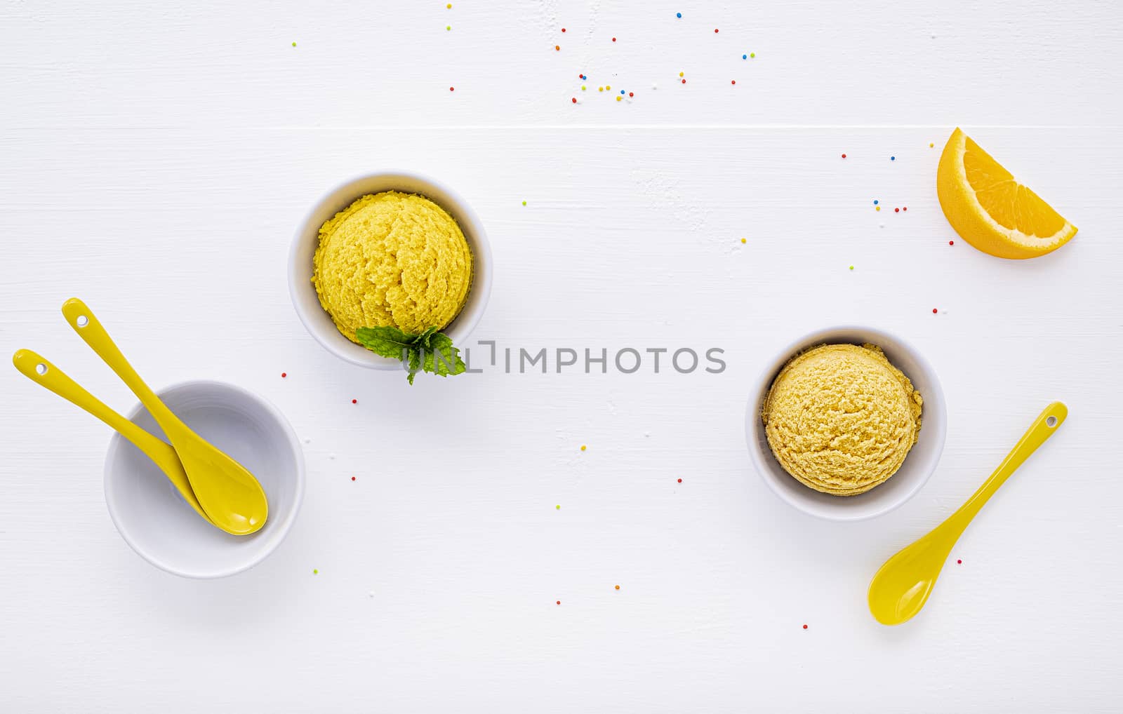 Various of ice cream flavor lemon and orange set up on white wooden background . Summer and Sweet menu concept.