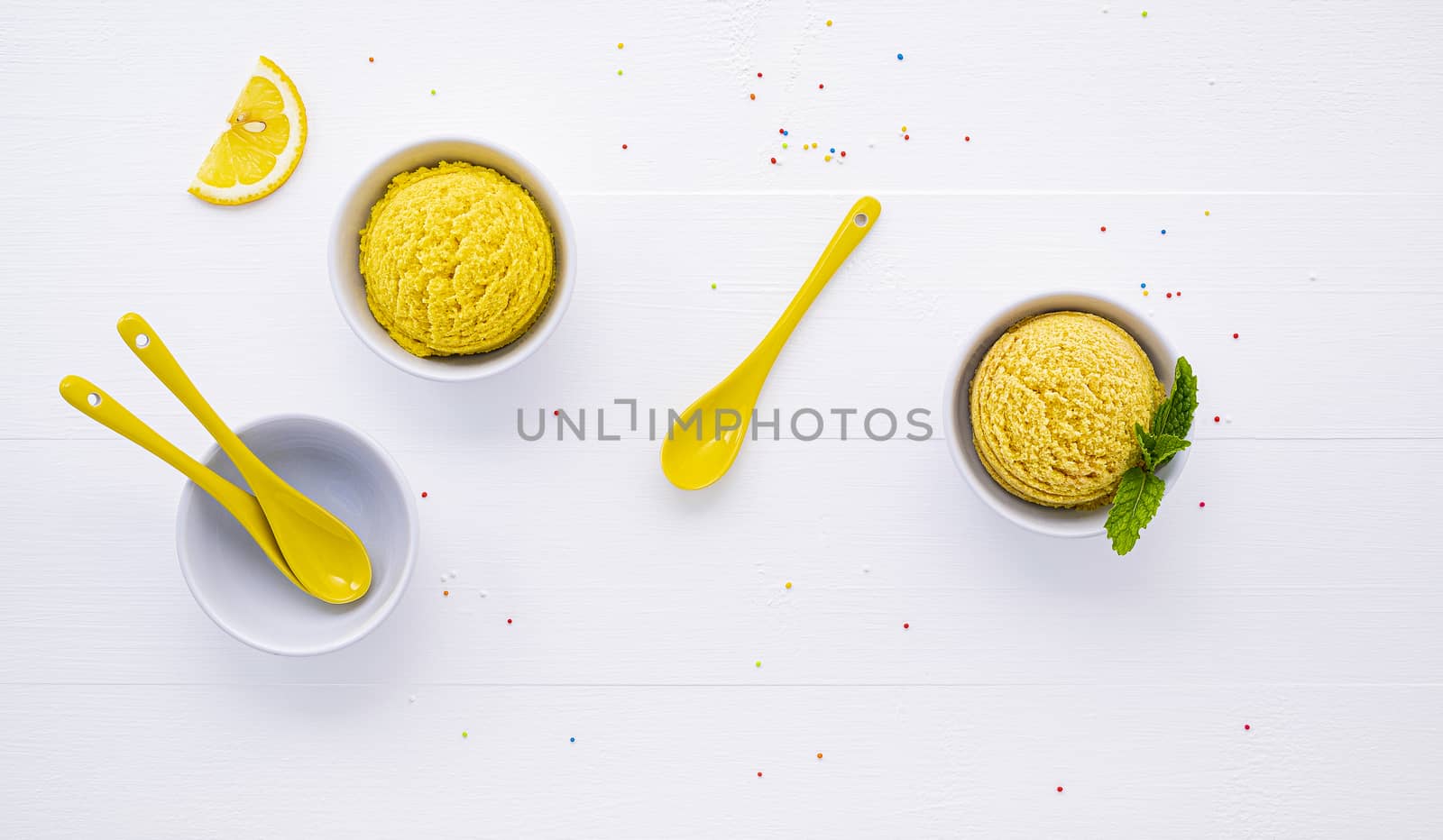 Various of ice cream flavor lemon and orange set up on white wooden background . Summer and Sweet menu concept.