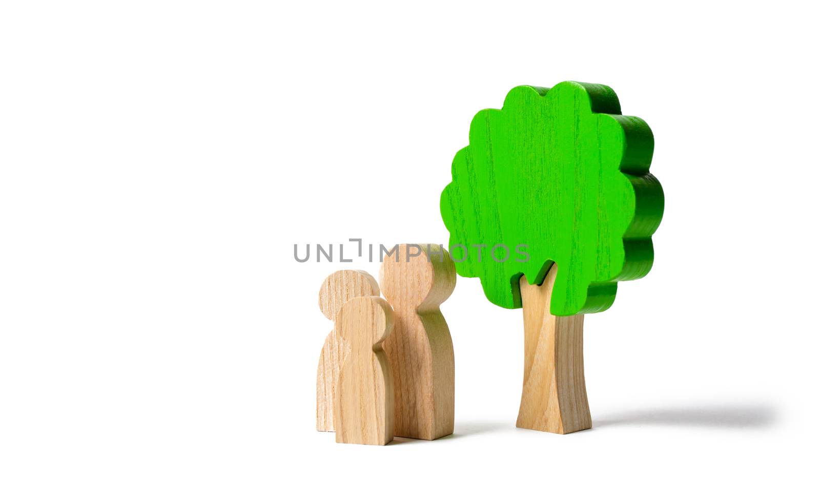 Family figures are standing near the tree on an isolated background. Pastime with family, kinship and parenting. Instilling good qualities and values in a healthy society. The concept of happiness