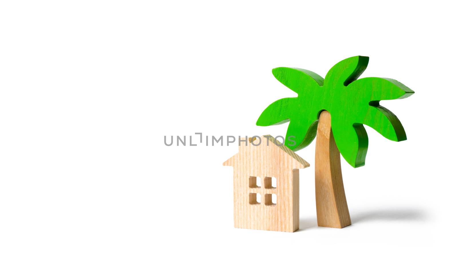 Wooden palm tree and hut on an isolated background. Conceptual leisure and vacation. Rental homes and properties in the resort. Romantic travel. Entertainment and relaxation.