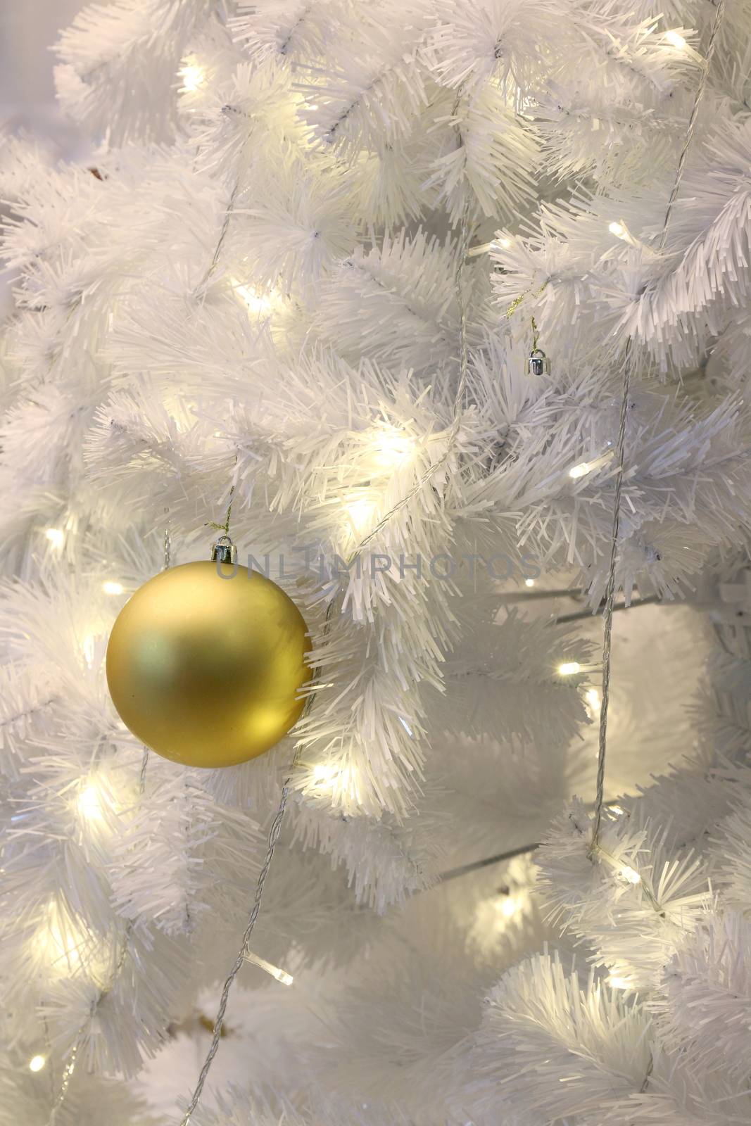 Golden ball on White Christmas tree background decoration (selective focus) by cgdeaw