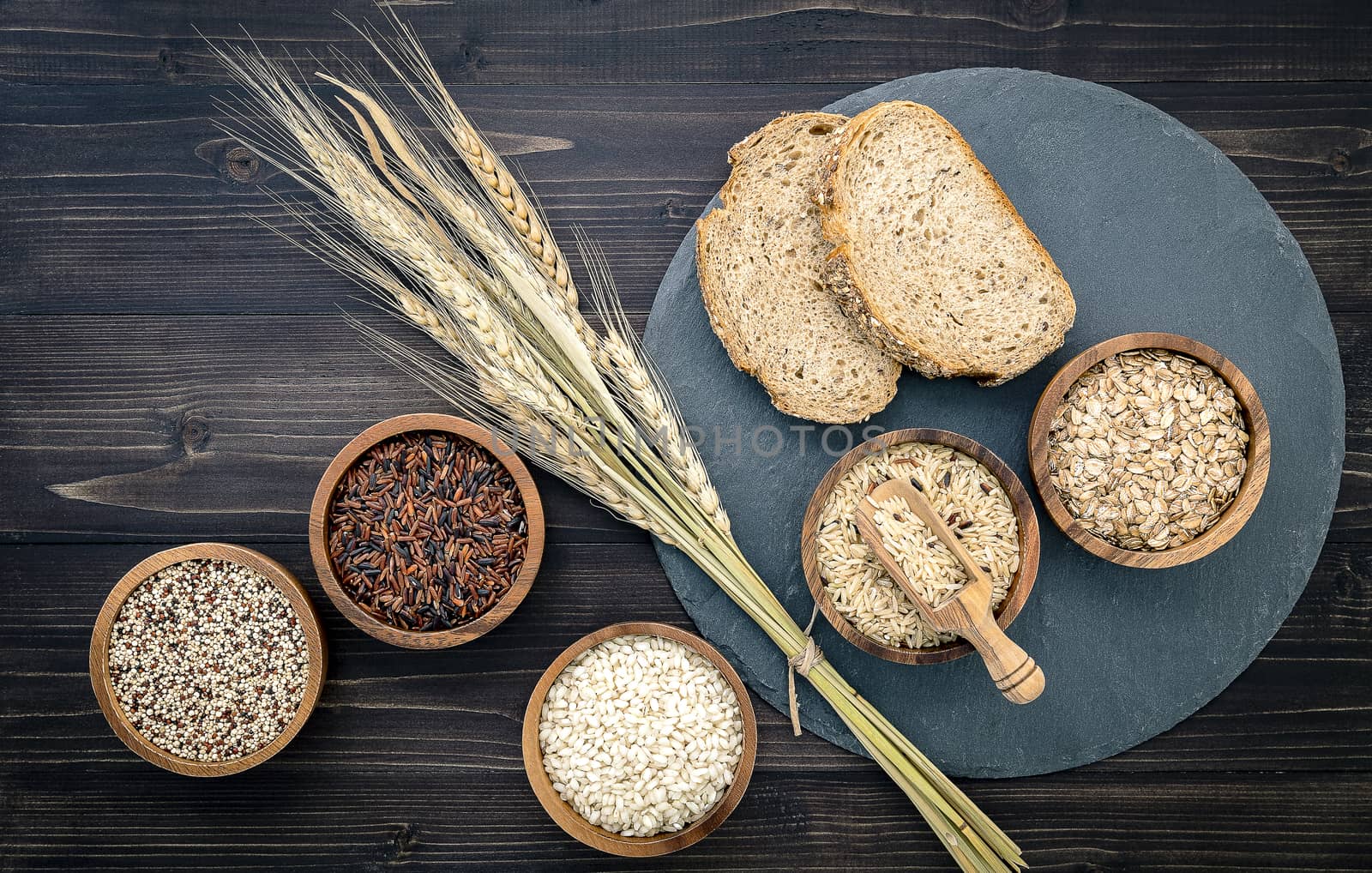 Various natural organic cereal and whole grains seed in wooden bowl for healthy food ingredient product concept.