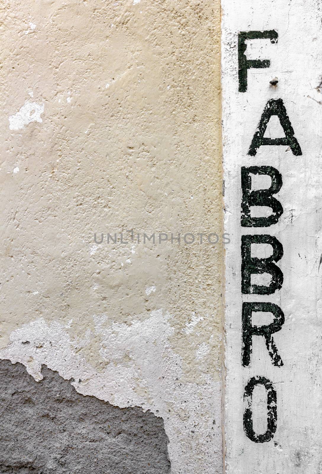 Exterior of a blacksmith's shop ("fabbro" translation from Italian).