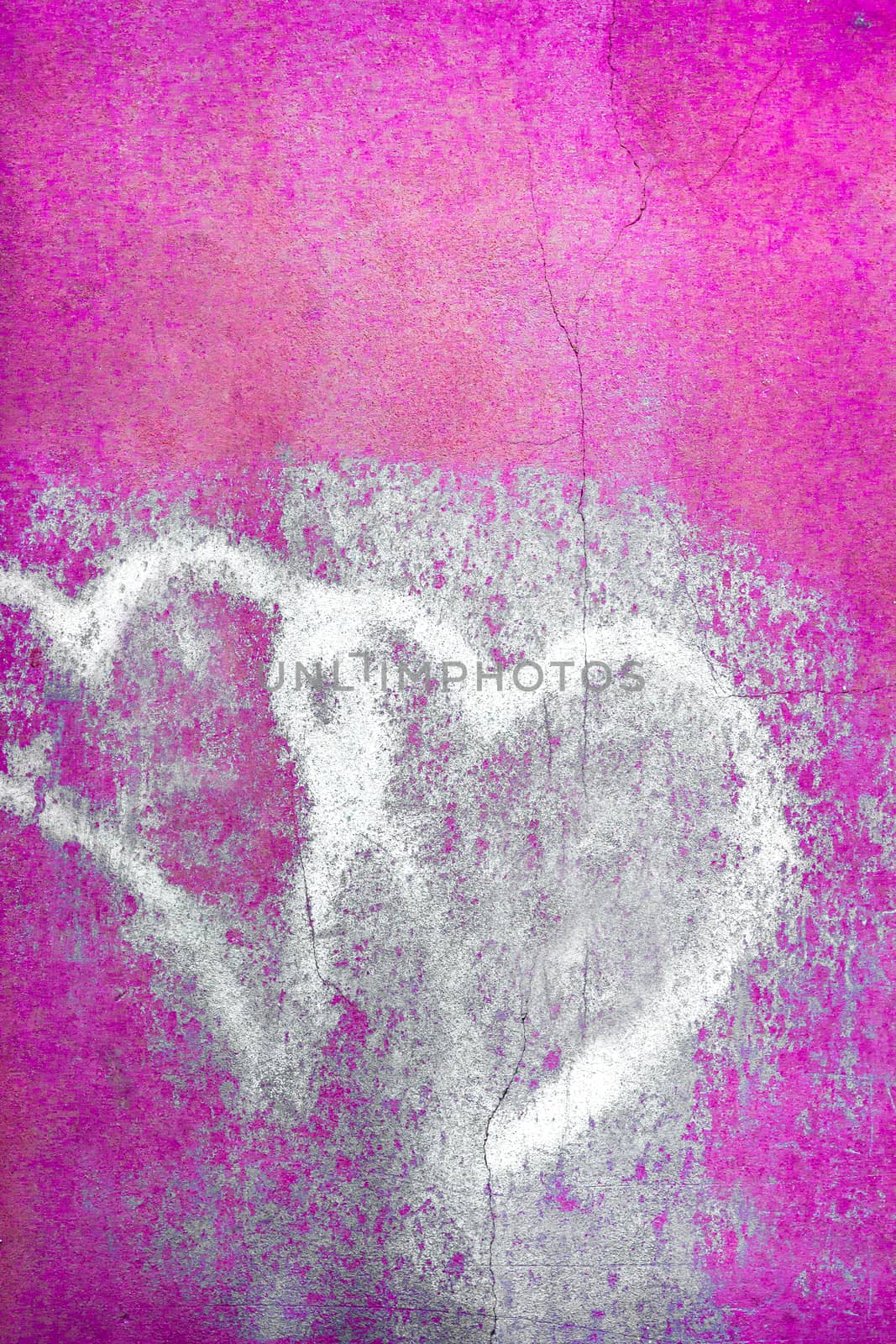 Grungy pair of faded hearts. Pink wall background. For your flyers, greetings card and more.