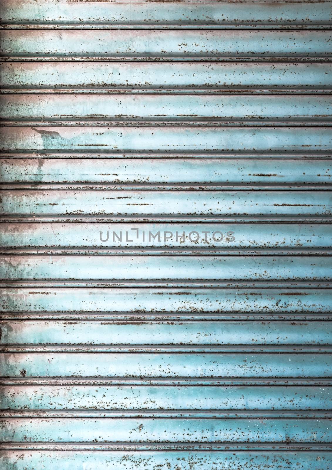 Grungy light blue metal window roller blinds background