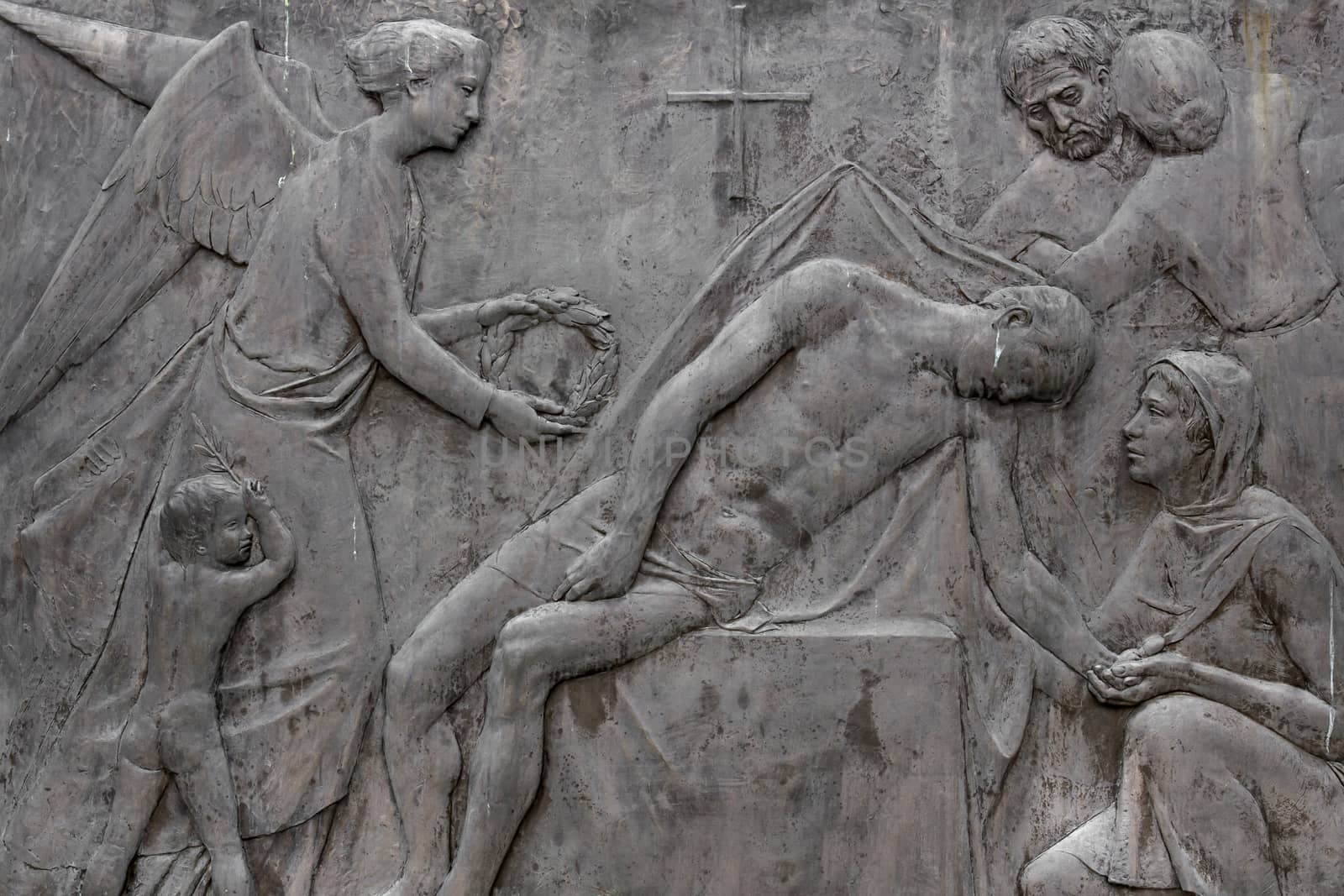 Detail of the Pieta scene in bas-relief, depicting Death