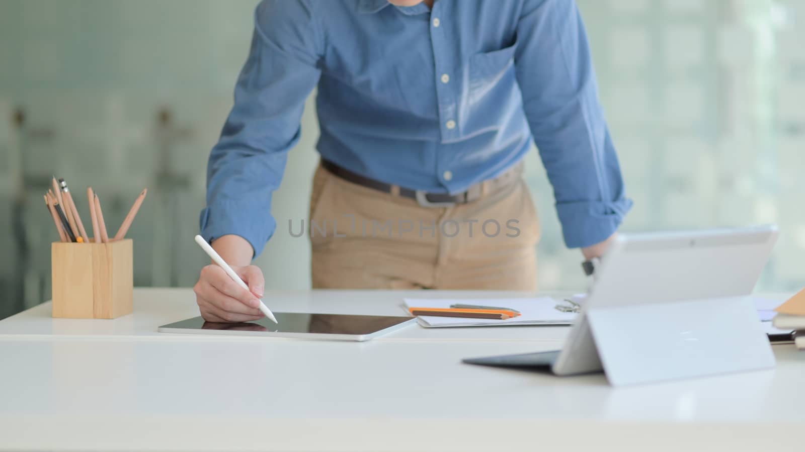 Cropped shot of A professional designer is working on a modern tablet to design his future project in a comfortable office.