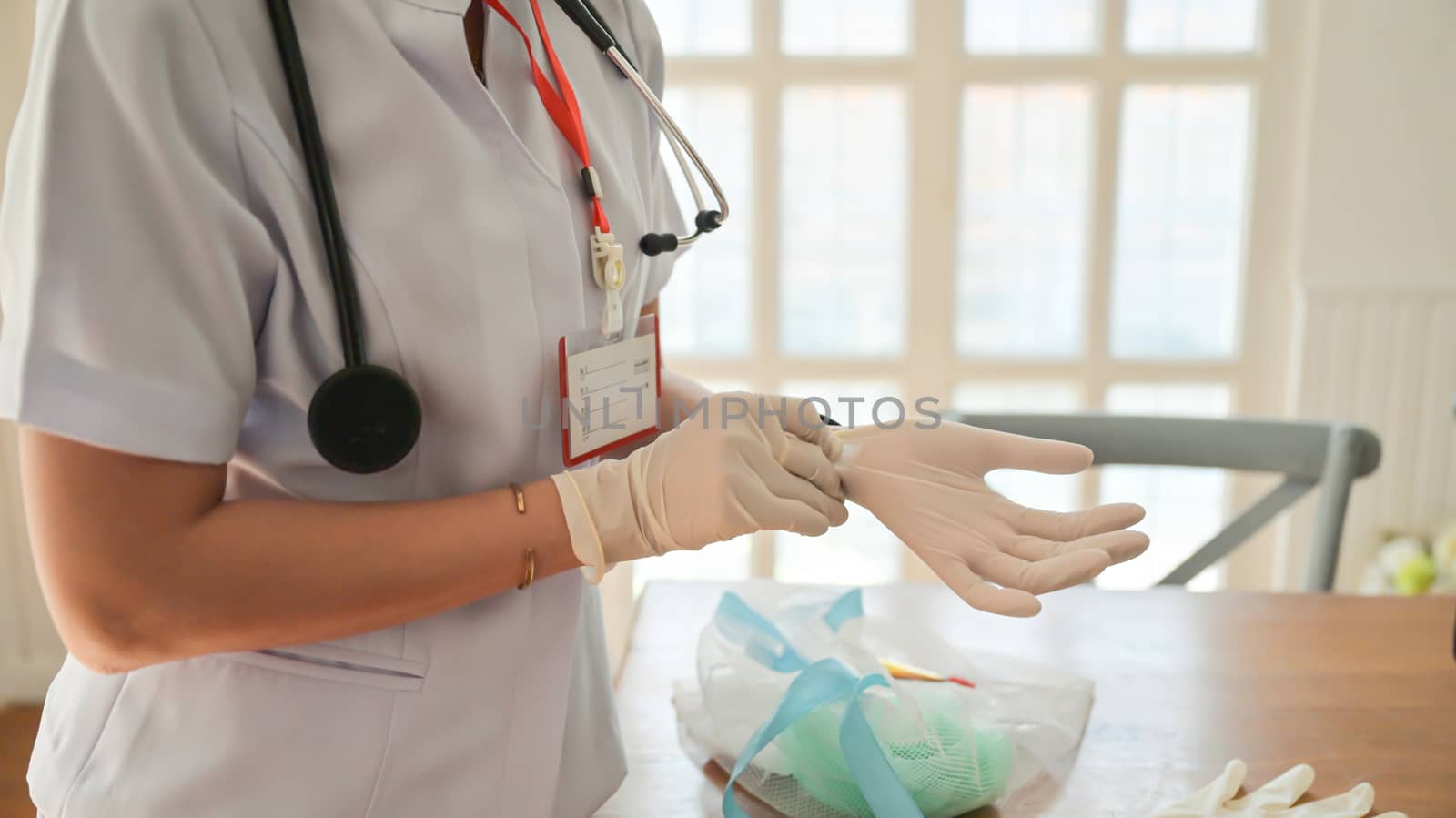 Cropped shot of Nurse is wearing gloves to protect the corona virus while working.