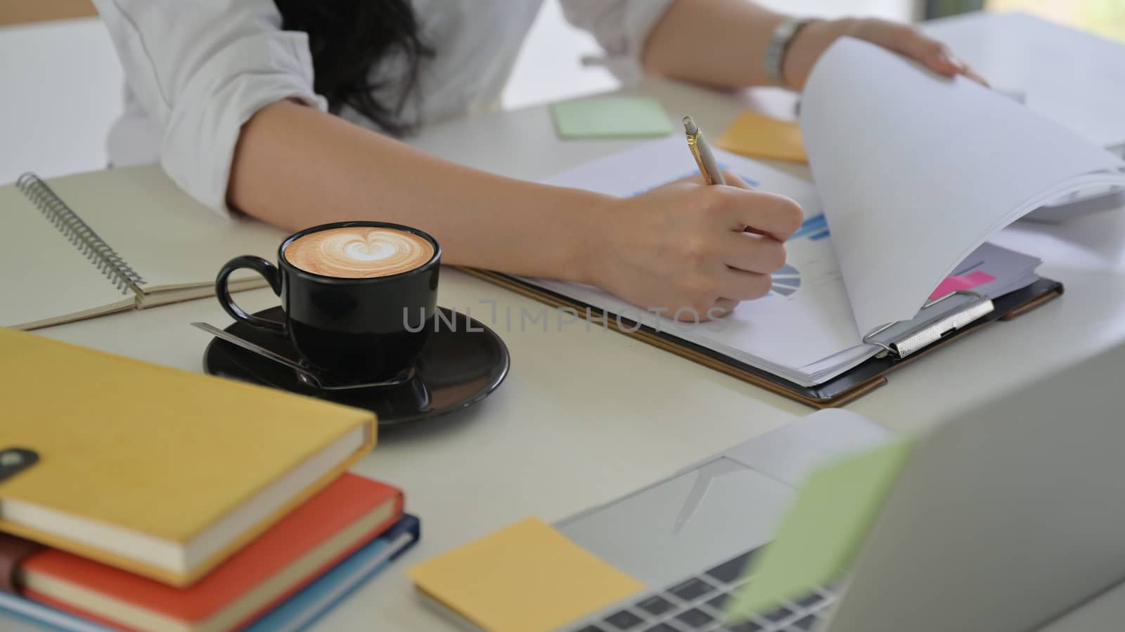 Management is checking information including coffee in the office.