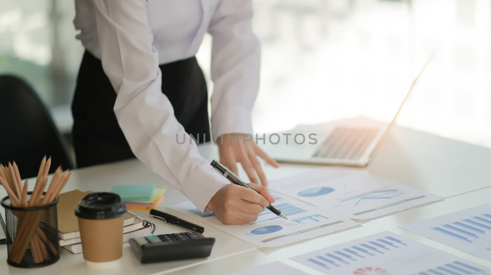 The auditor is analyzing the data graph of the organization in a modern office.