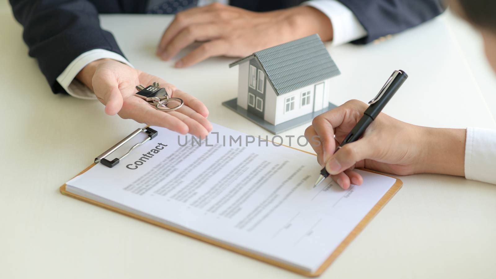 Real estate concept,Customer signing contract about home loan ag by poungsaed