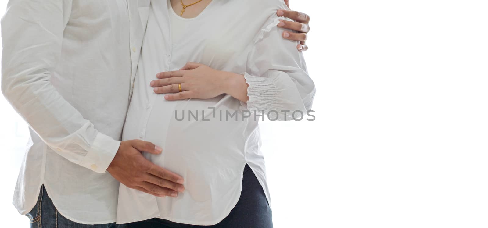 Men standing and embrace pregnant women. by poungsaed