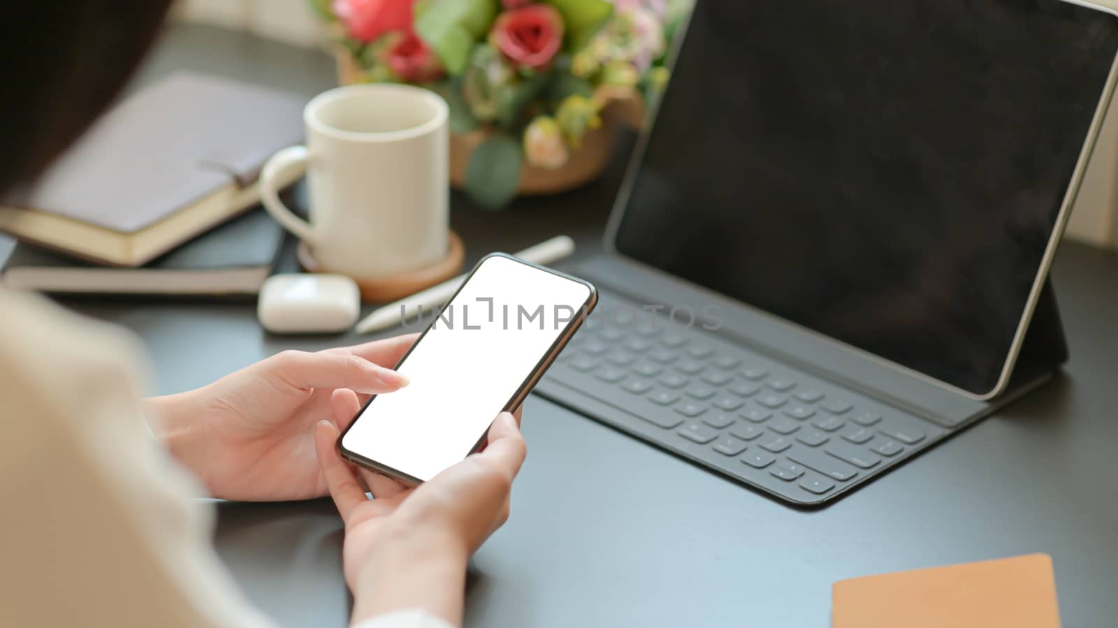 Close-up view of businesswoman searching for important information with a smartphone for her new project.