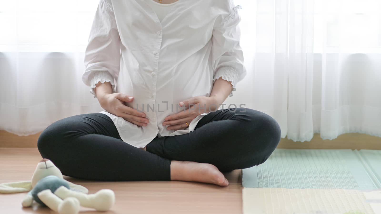 The pregnant woman uses the handle on the belly, She sat by the  by poungsaed