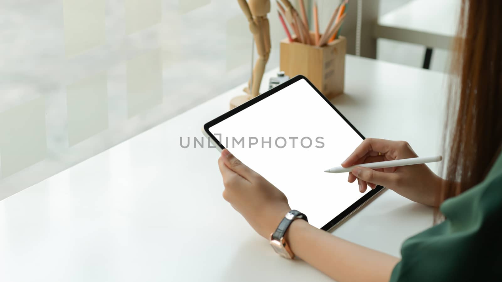 Graphic designer draw a digital tablet at office studio.