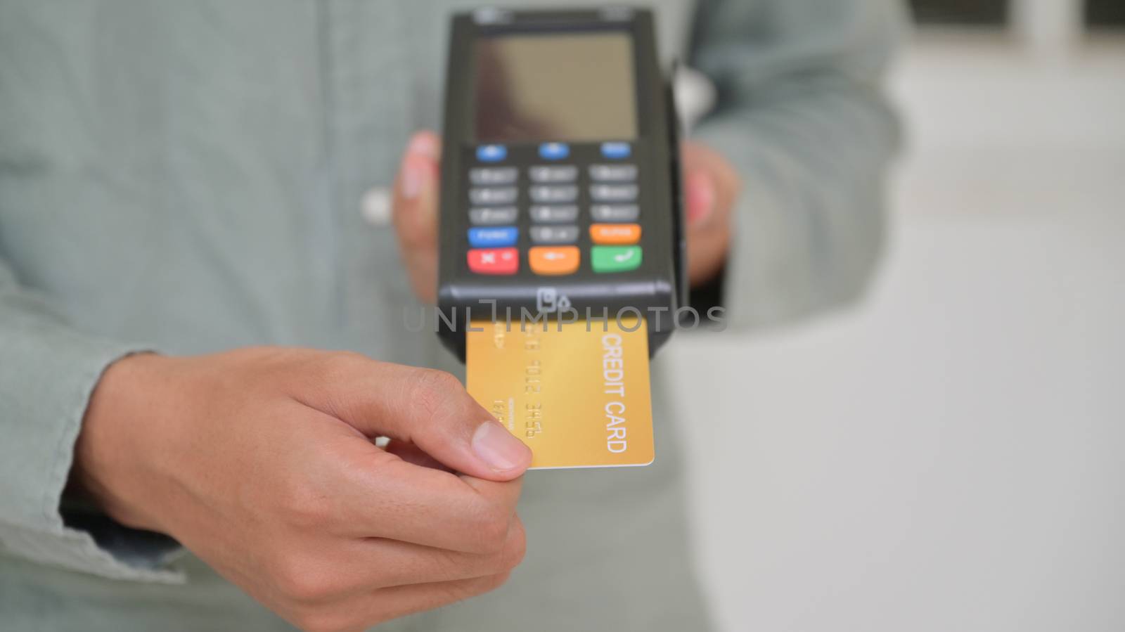 Close - up shot of Employees accept credit card payments via EDC.