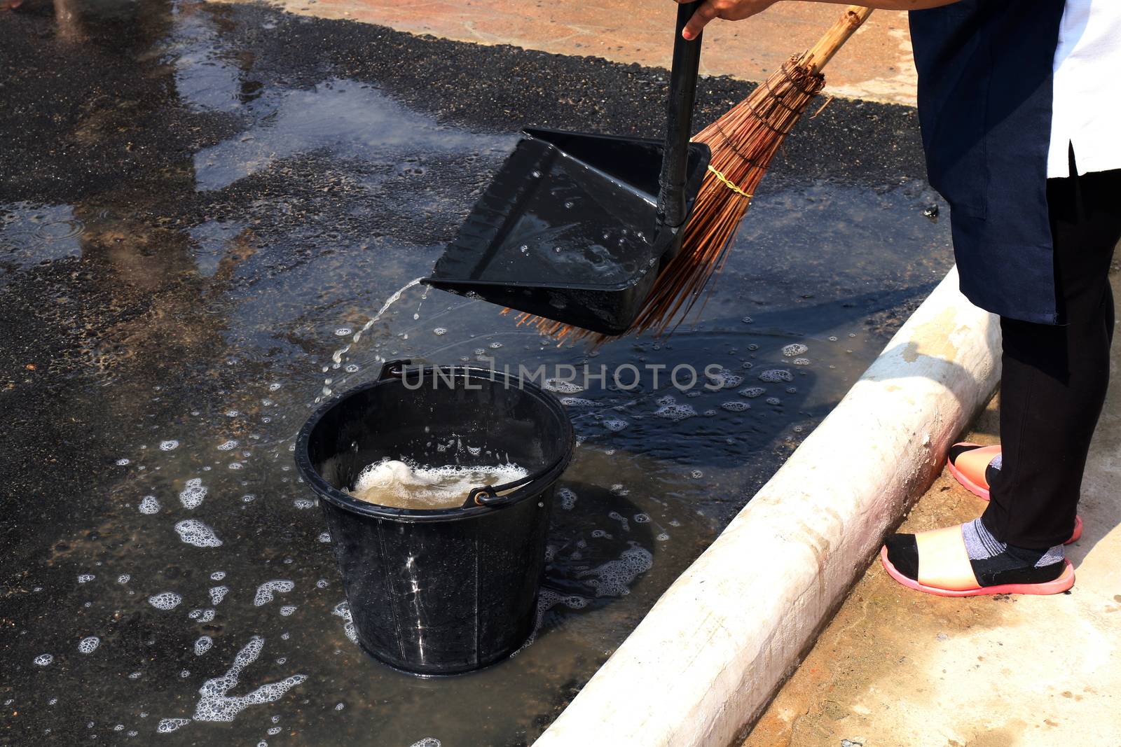 people are sweeping dirty water at ground streets, cleaner floor, housemaid, housekeeper, homemaker, maidservant, maid