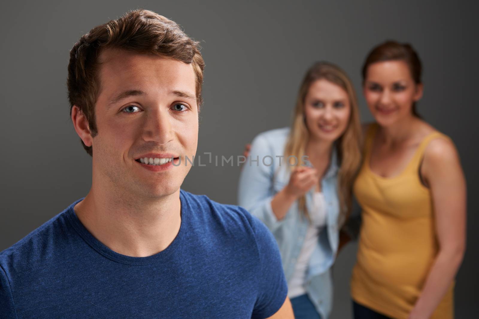 Young Man Being Talked About By Women