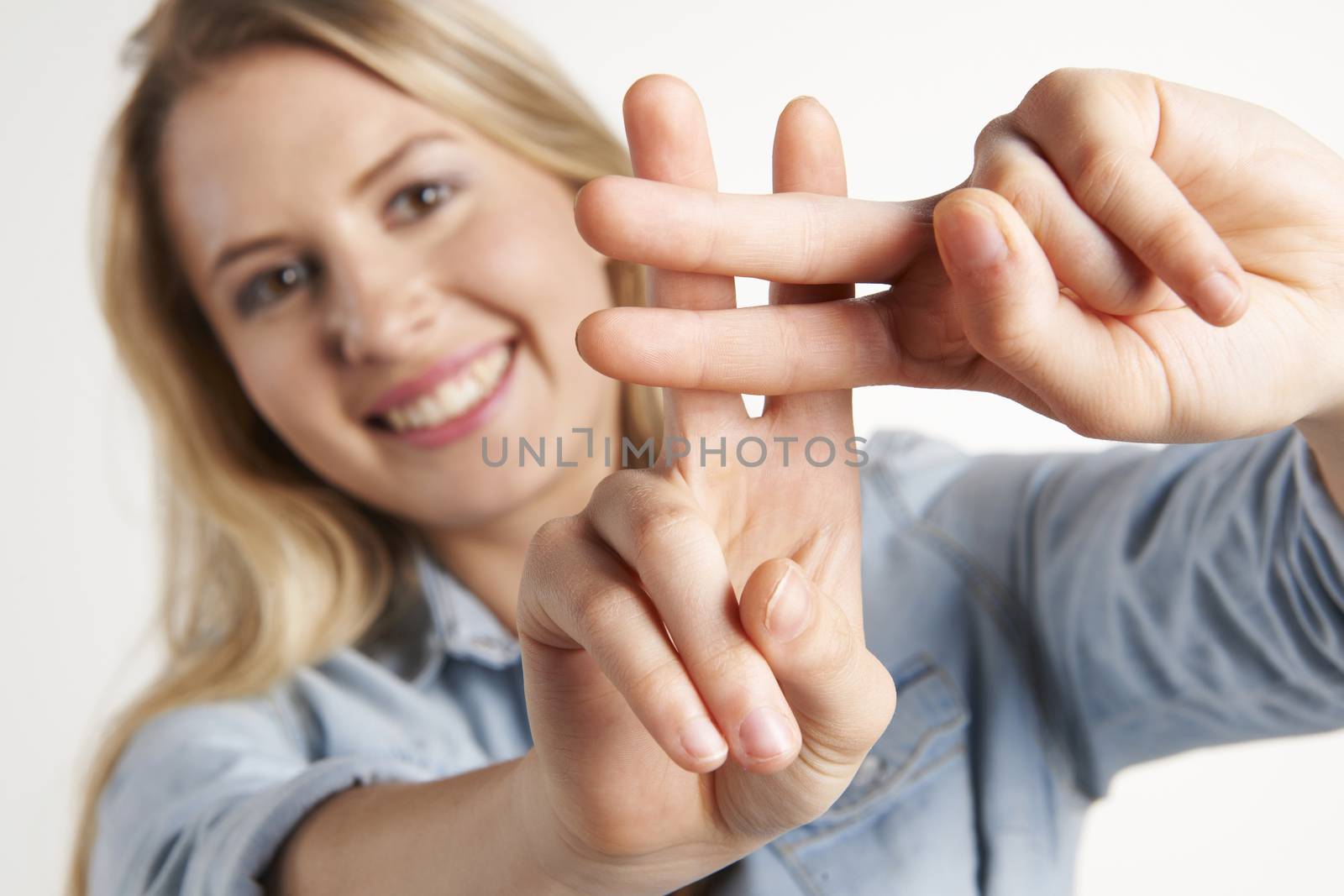 Pretty Girl Making Hashtag Sign With Fingers by HWS