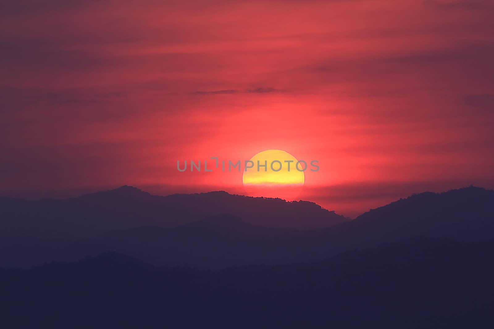 Evening sunset surrounded by clouds