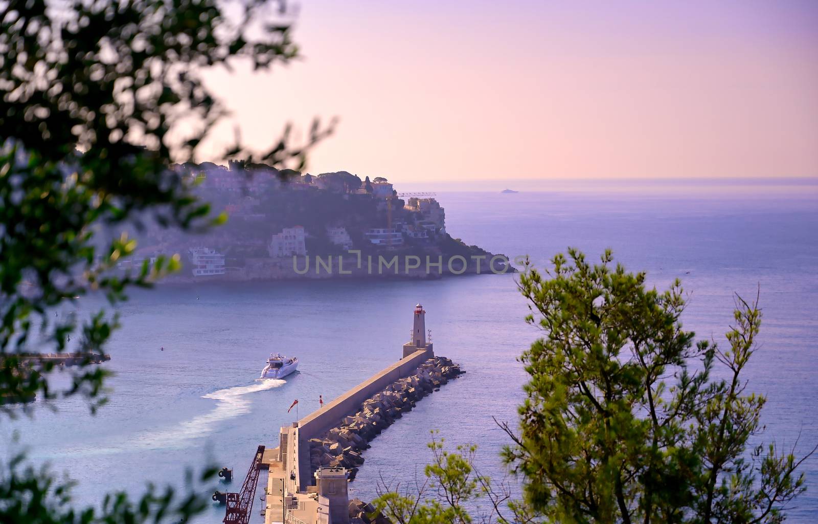 The lighthouse at the Port of Nice on the Mediterranean Sea at Nice, France along the French Riviera.