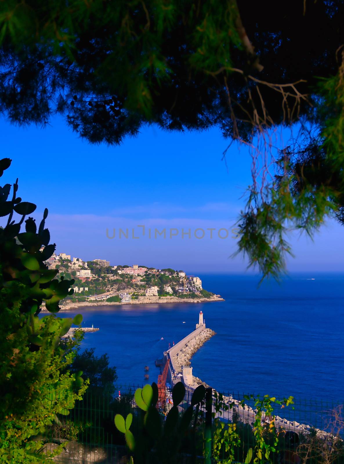 The lighthouse at the Port of Nice on the Mediterranean Sea at Nice, France along the French Riviera.