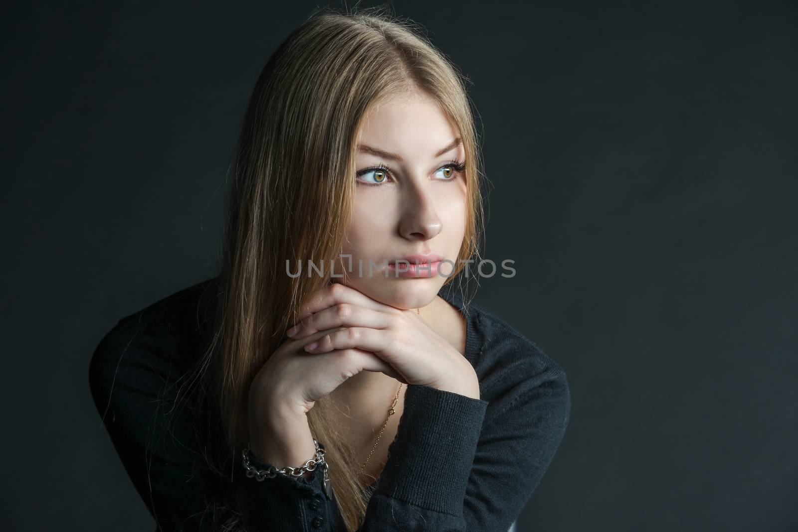 Spiritual and mental studio portrait of the Russian beautiful teenage girl with light long hair