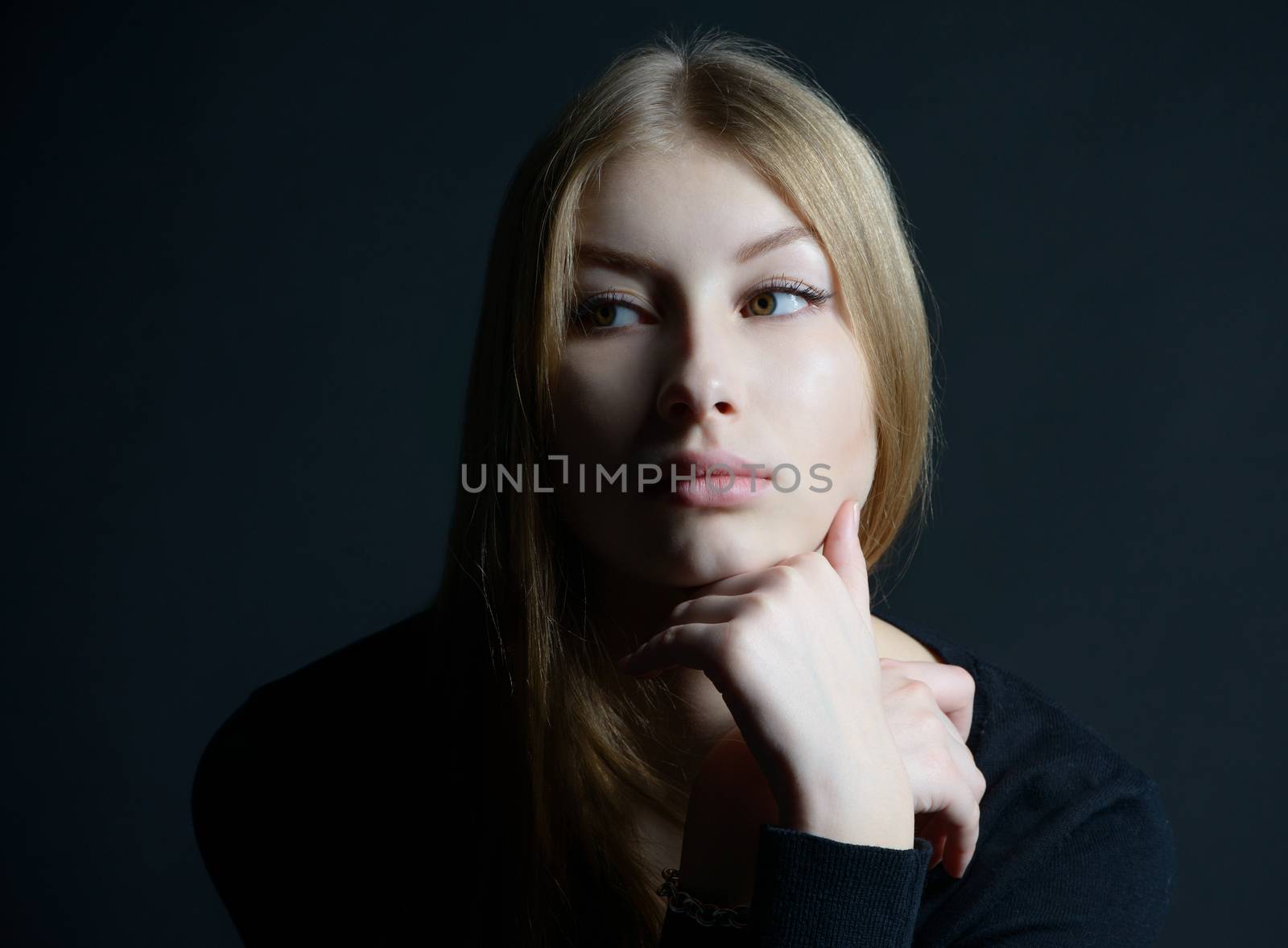 Spiritual and mental studio portrait of the Russian beautiful teenage girl with light long hair