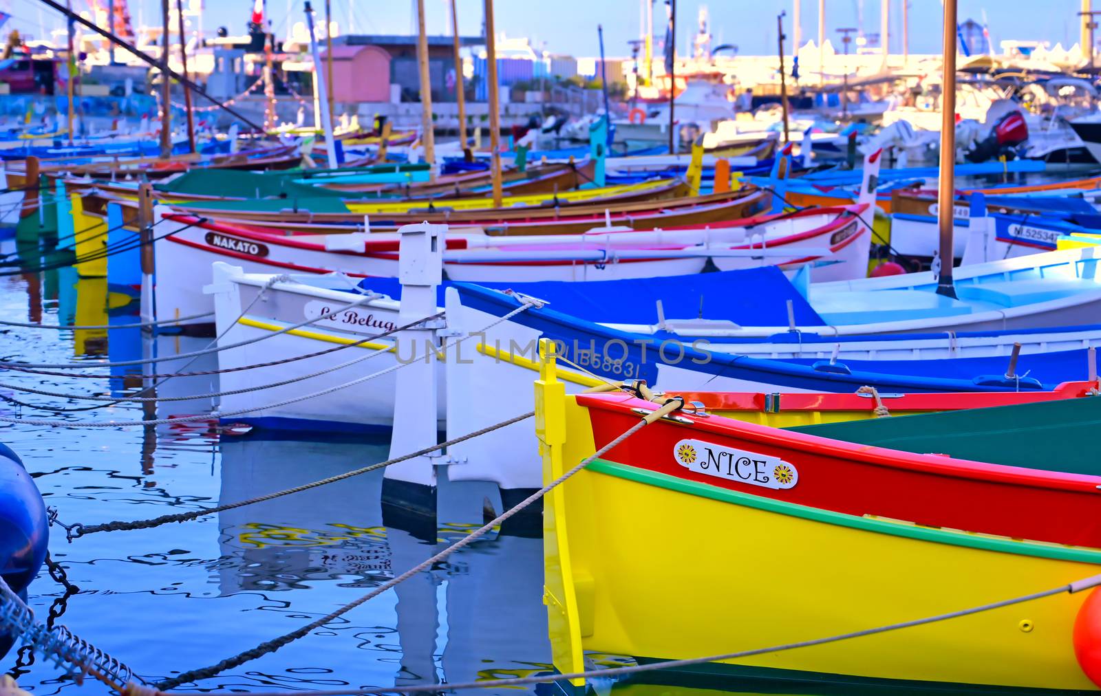 Nice, France - June 08, 2019 - Fishing boats docked in the port along the French Riviera on the Mediterranean Sea at Nice, France.