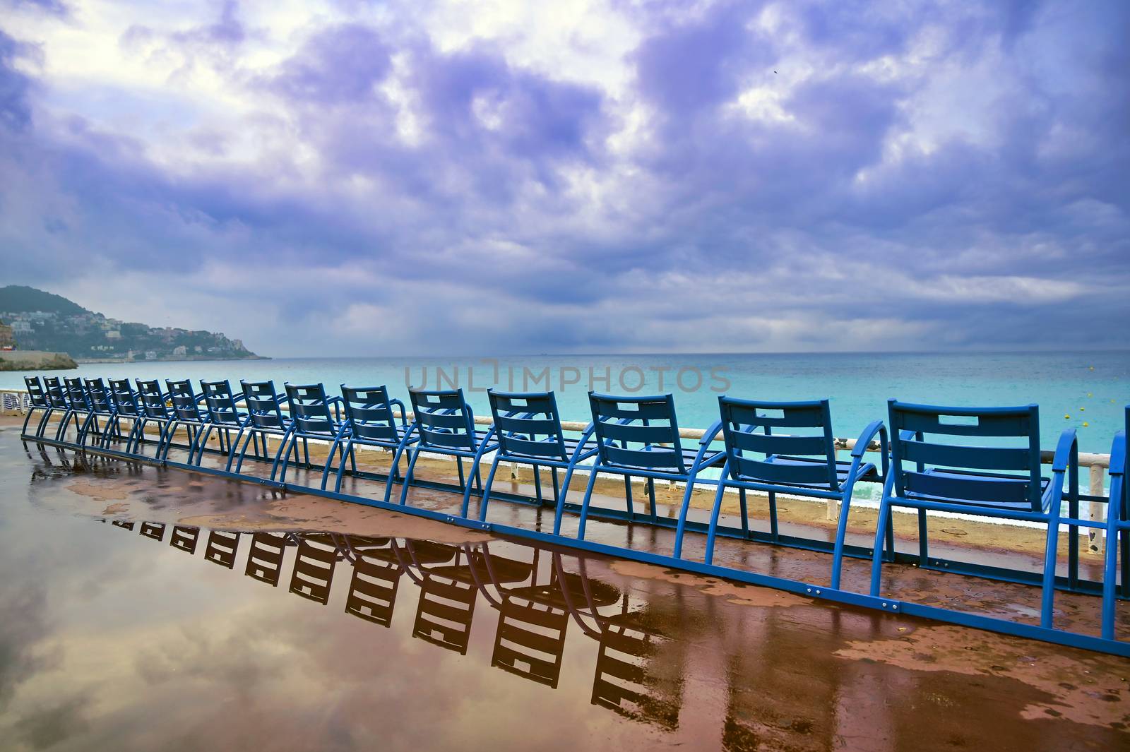 Blue chairs in Nice, France by jbyard22