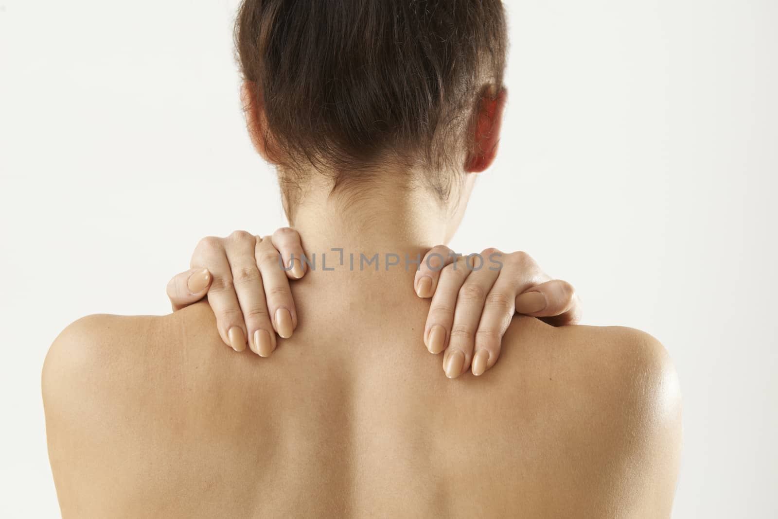 Studio Shot Of Woman With Painful Neck