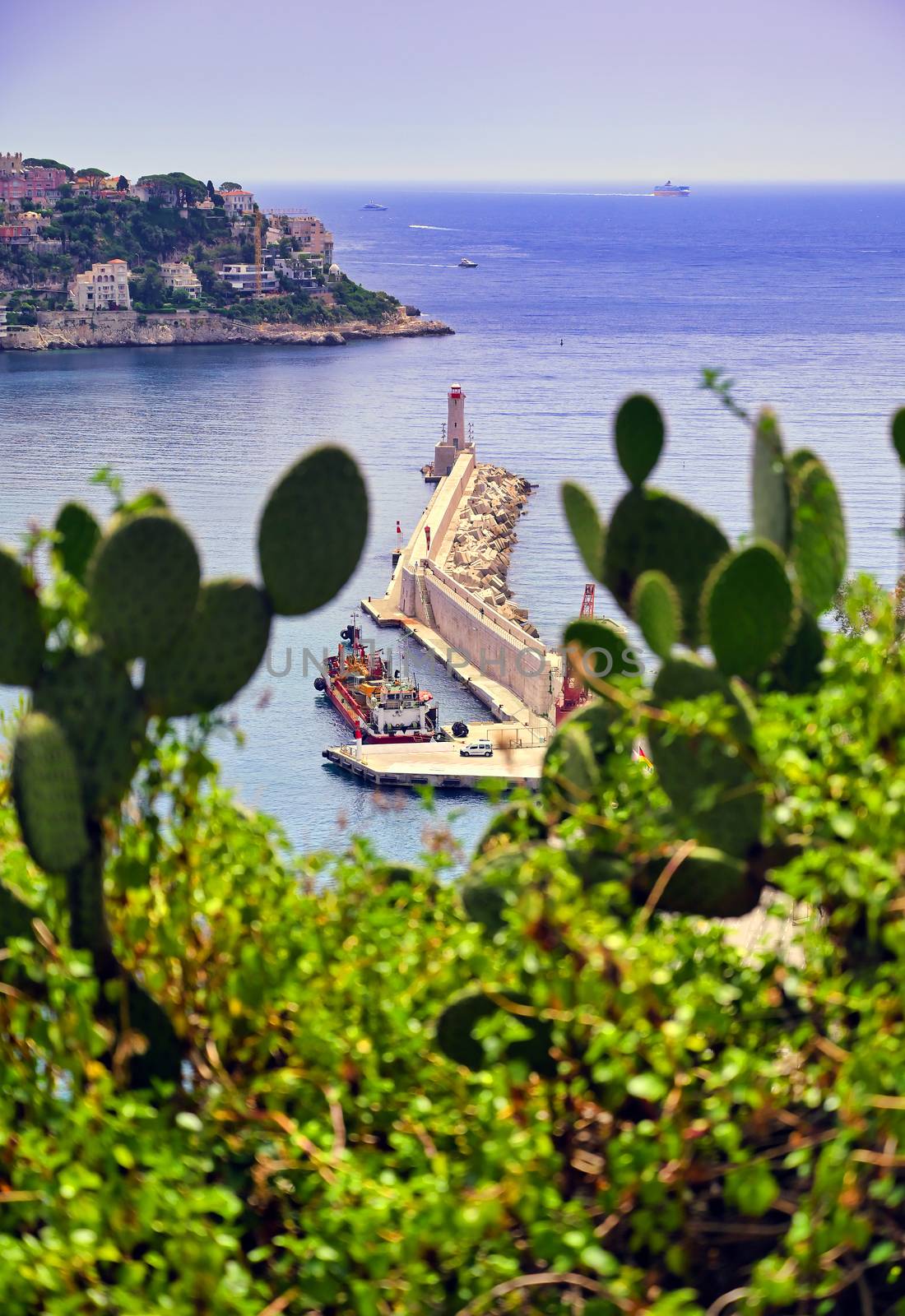 The lighthouse at the Port of Nice on the Mediterranean Sea at Nice, France along the French Riviera.