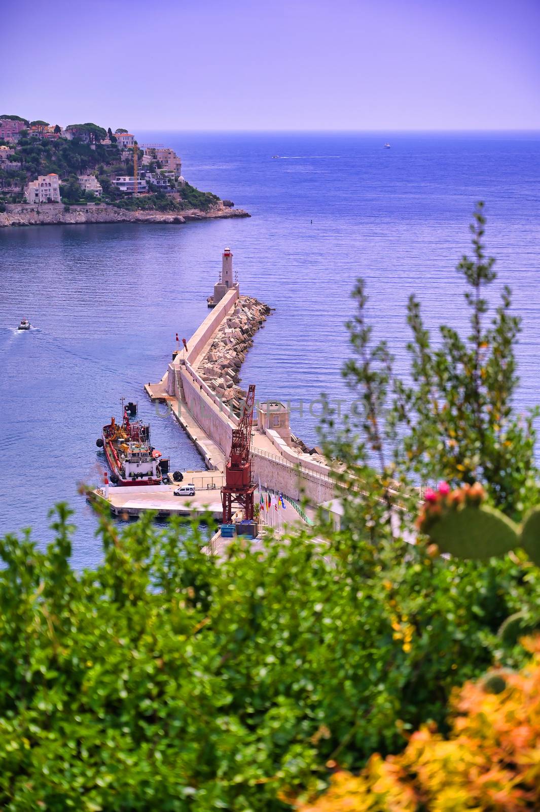 The lighthouse at the Port of Nice on the Mediterranean Sea at Nice, France along the French Riviera.