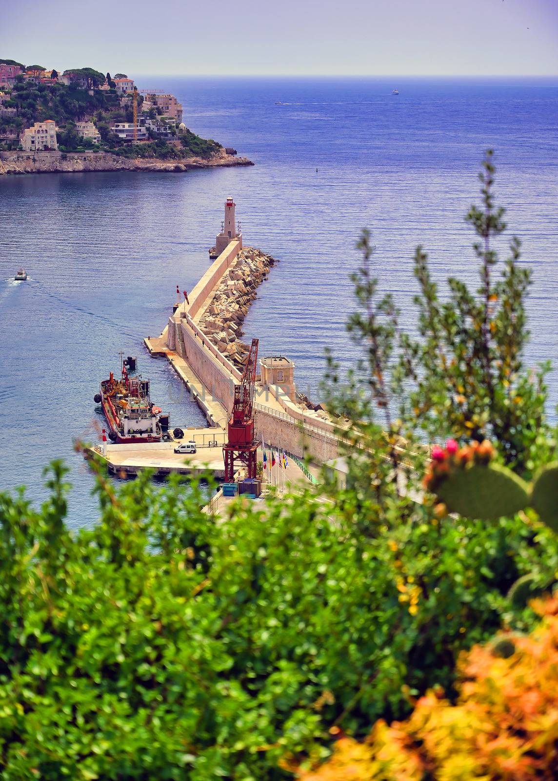 The lighthouse at the Port of Nice on the Mediterranean Sea at Nice, France along the French Riviera.