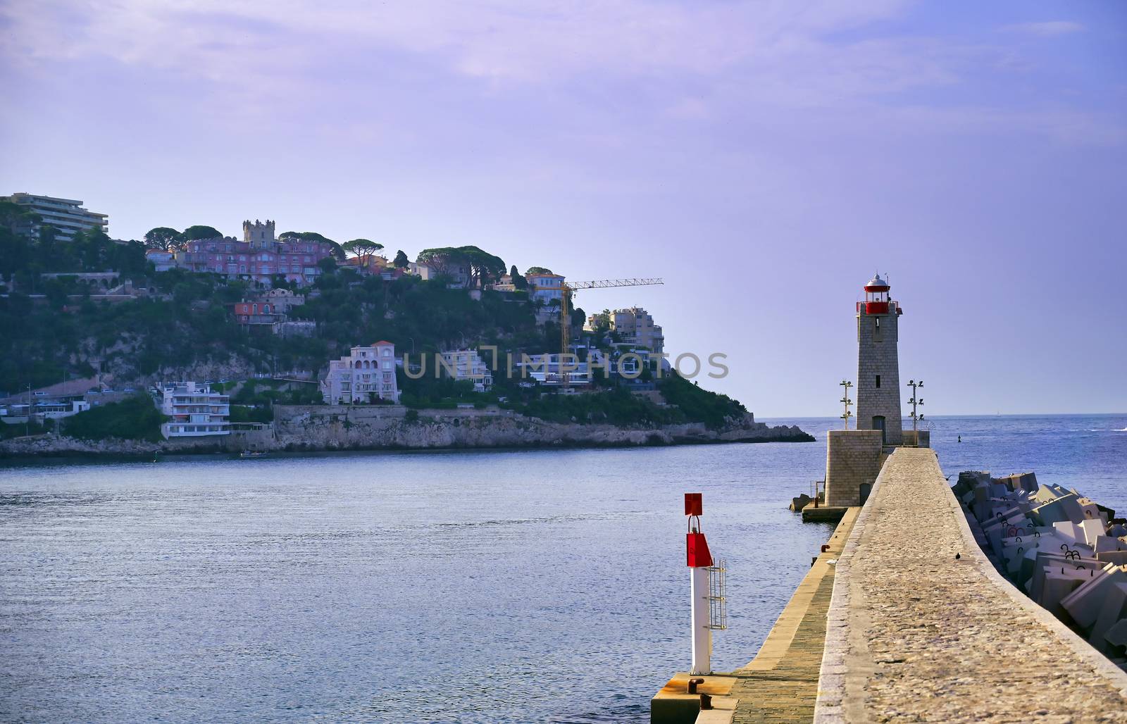 The lighthouse at the Port of Nice on the Mediterranean Sea at Nice, France along the French Riviera.