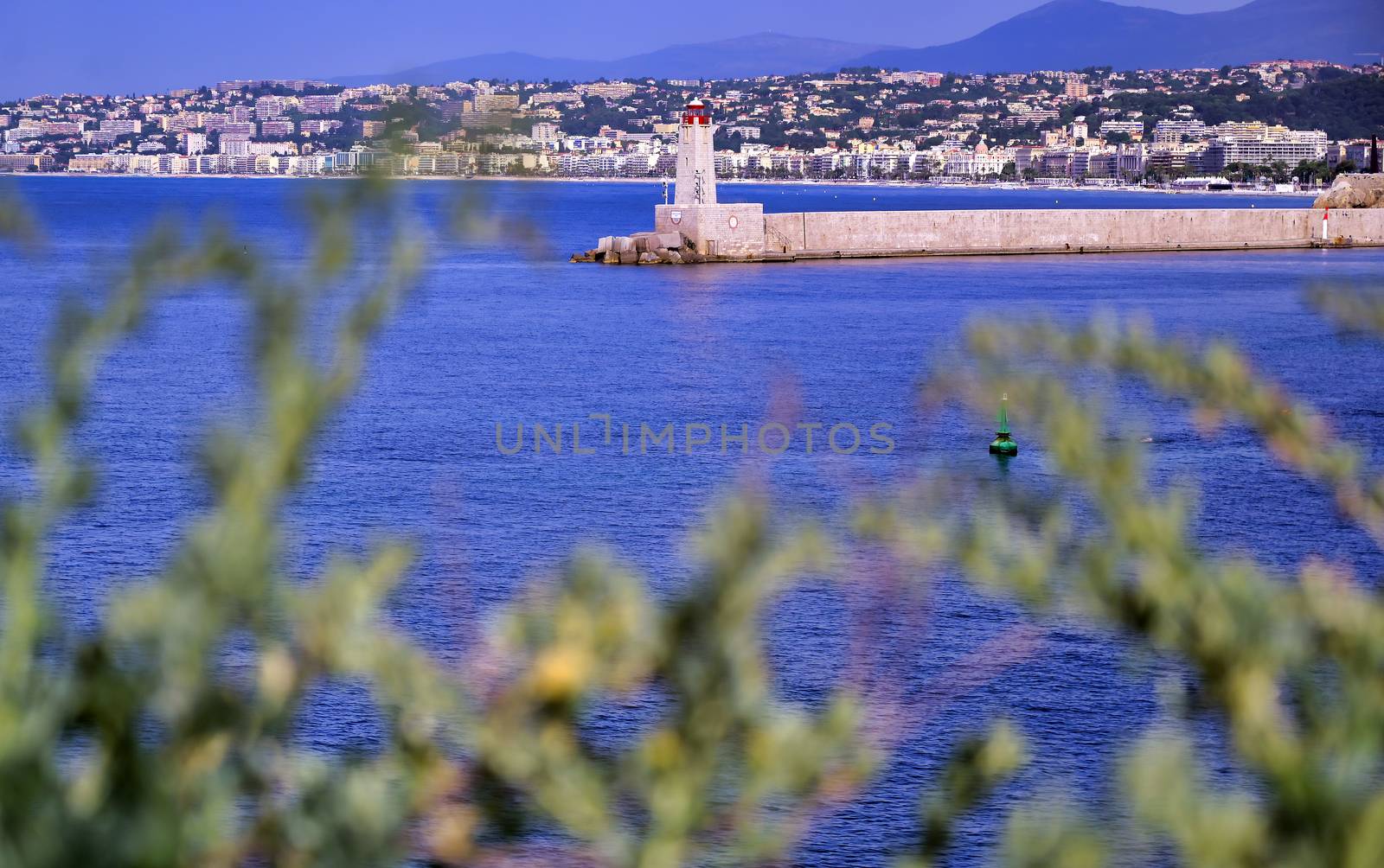 The lighthouse at the Port of Nice on the Mediterranean Sea at Nice, France along the French Riviera.