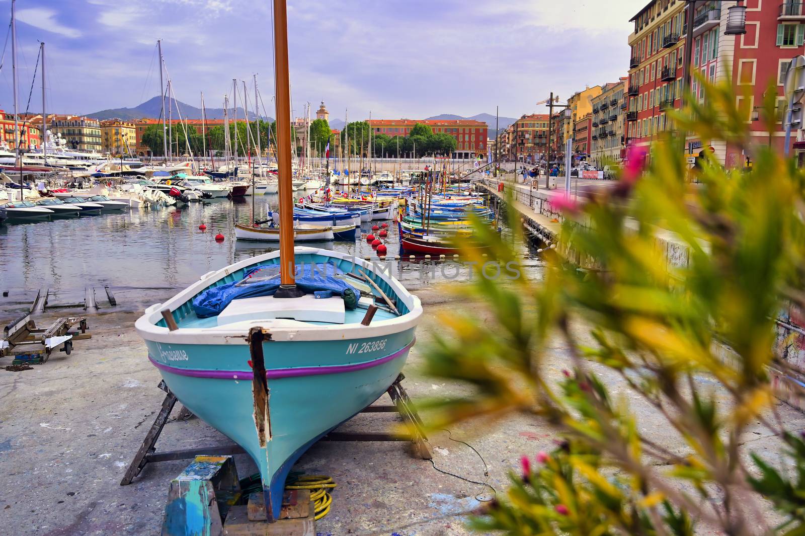 Nice, France - June 11, 2019 - Fishing boats docked in the port along the French Riviera on the Mediterranean Sea at Nice, France.